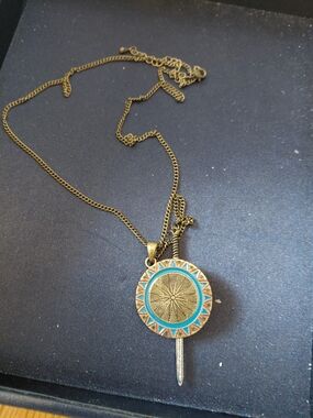 DC Comics Gold-Tone Sunburst Pendant Necklace with Turquoise Accents